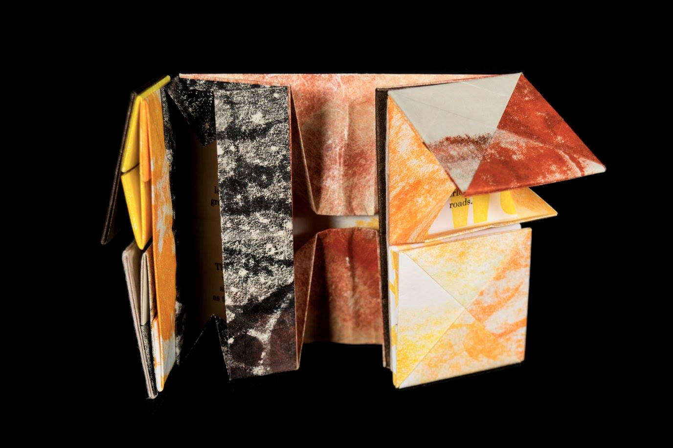 an artist book made of layers of folded paper boxes glue to each other