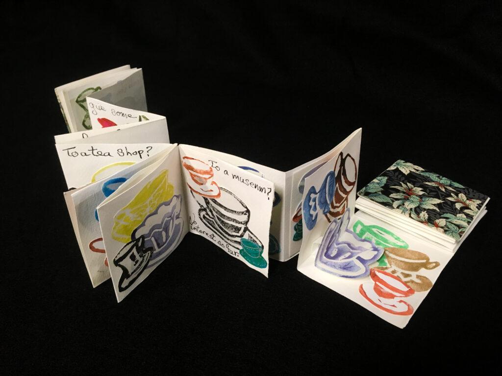 long snake book (meandering accordion book) with multi-colored teacup prints