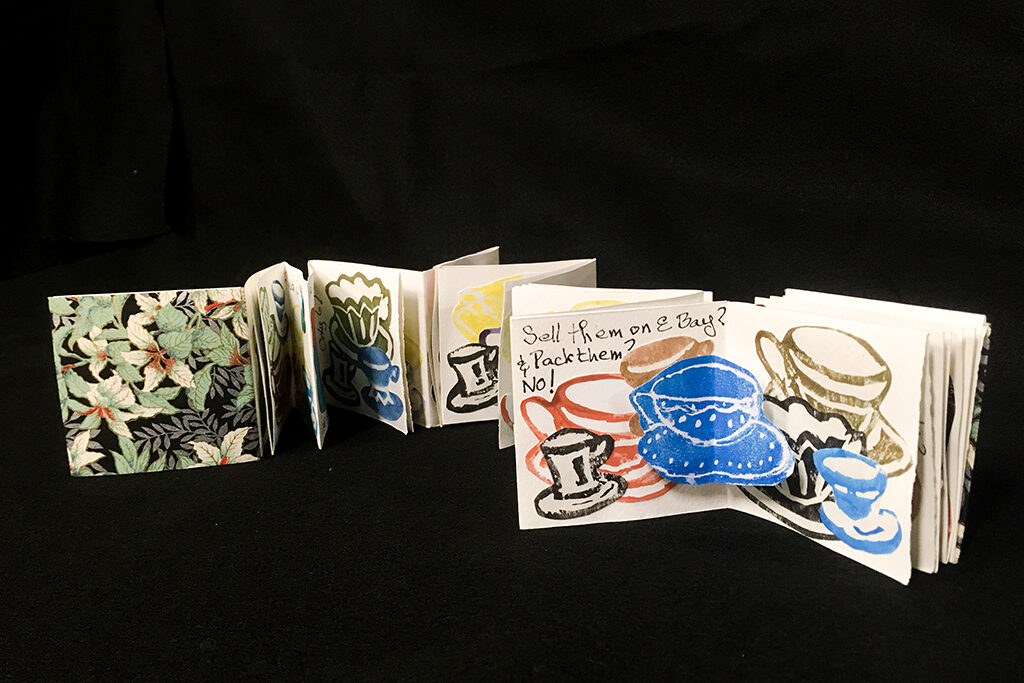 Photo of a snake book with many teacup block prints. Link to Student Work page.